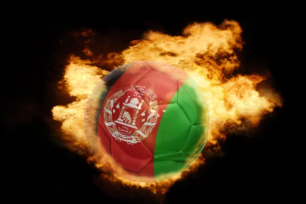 Football ball with the flag of afghanistan on fire — Stock Photo, Image