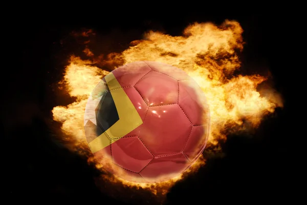 Ballon de football avec le drapeau du Timor oriental en feu — Photo