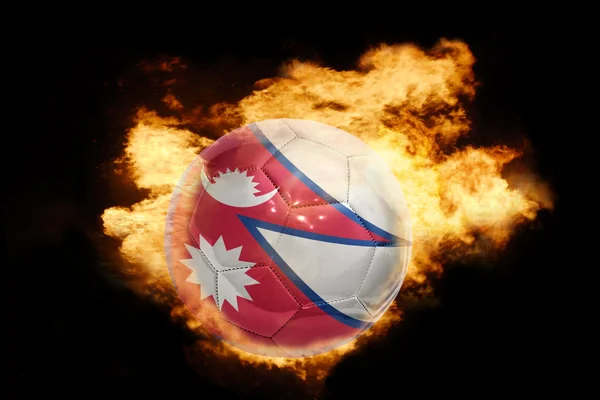 Fotboll boll med flaggan i nepal i brand — Stockfoto
