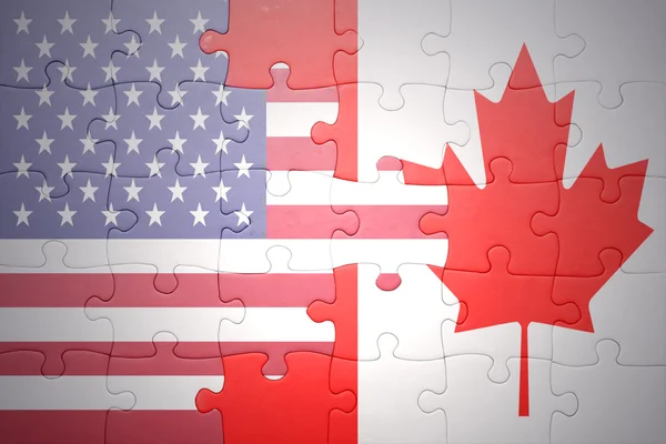Puzzle with the national flags of united states of america and canada — Stock Photo, Image