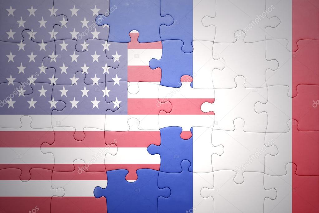 puzzle with the national flags of united states of america and france