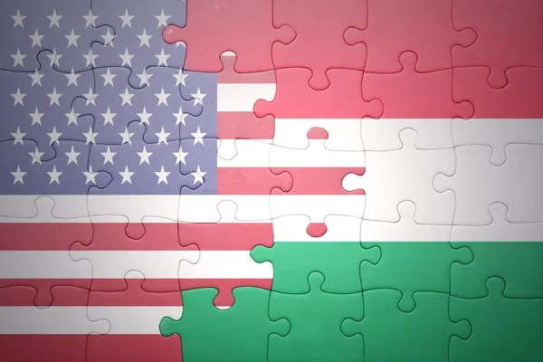 Puzzle with the national flag of united states of america and hungary — Stock Photo, Image