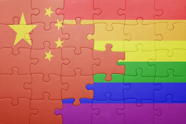 Puzzle with the national flag of china and gay flag — Stock Photo, Image