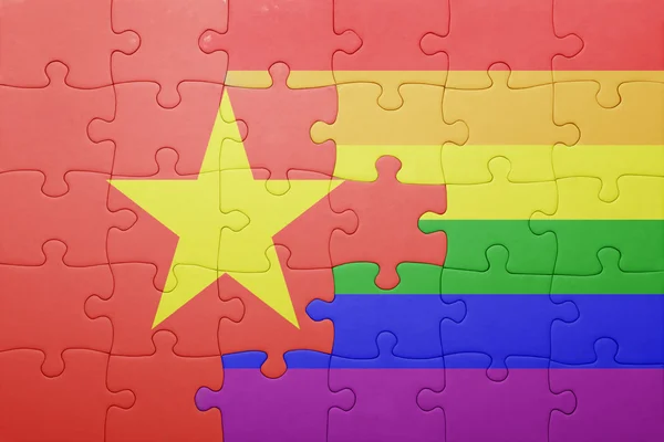 Puzzle with the national flag of vietnam and gay flag — Stock Photo, Image