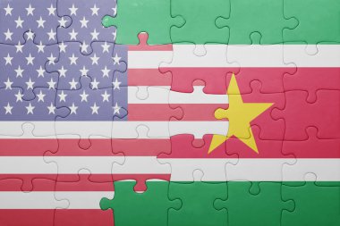 puzzle with the national flag of united states of america and suriname 