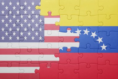 puzzle with the national flag of united states of america and venezuela 