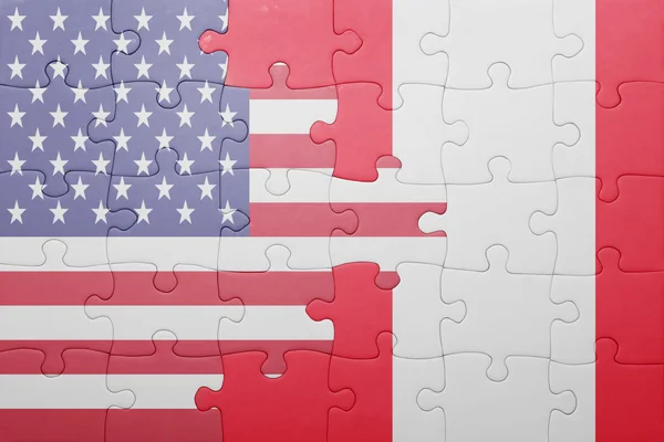 Puzzle with the national flag of united states of america and peru — 图库照片