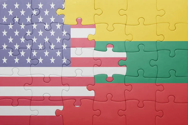 Puzzle with the national flag of united states of america and lithuania — Stok fotoğraf