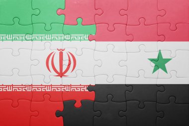puzzle with the national flag of syria and iran