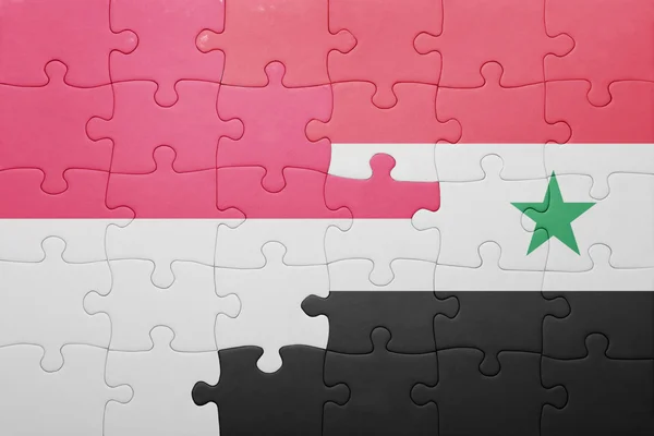 Puzzle with the national flag of syria and indonesia — Stockfoto