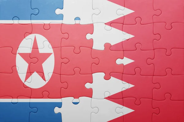 Puzzle with the national flag of bahrain and north korea — Stock Photo, Image
