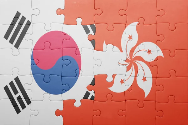 Puzzle with the national flag of hong kong and south korea — Stockfoto