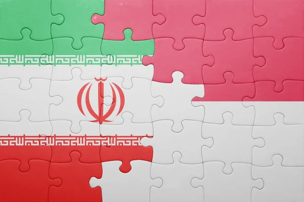 Puzzle with the national flag of indonesia and iran — 스톡 사진