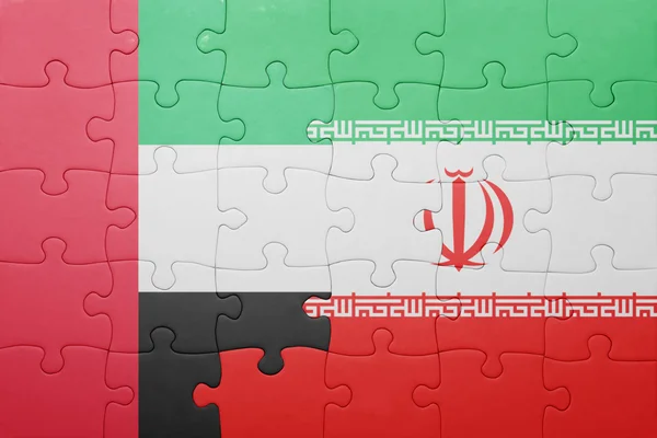 Puzzle con la bandiera nazionale di iran ed emirati arabi uniti — Foto Stock