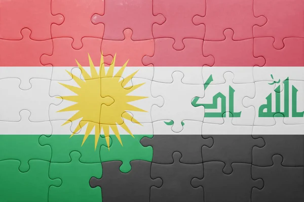 Quebra-cabeça com a bandeira nacional do Iraque e do Curdistão — Fotografia de Stock