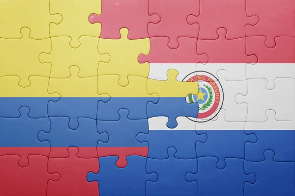 Rompecabezas con la bandera nacional de paraguay y colombia — Foto de Stock