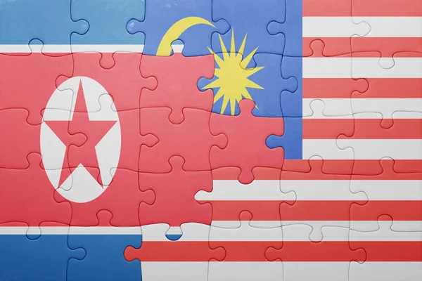 Puzzle with the national flag of malaysia and north korea — Stock Photo, Image