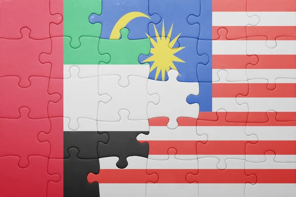 Puzzle with the national flag of malaysia and united arab emirates — Stock Photo, Image