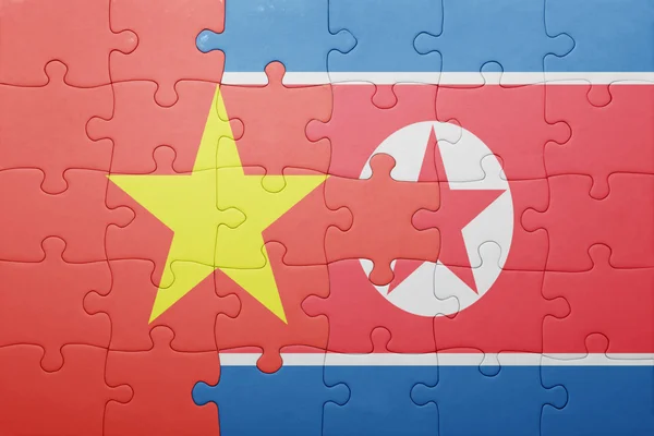 Puzzle with the national flag of north korea and vietnam — Stock Photo, Image