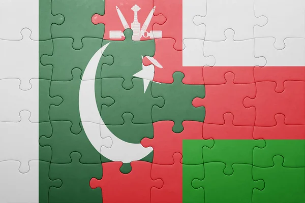 オマーン、パキスタンの国旗をパズルします。 — ストック写真