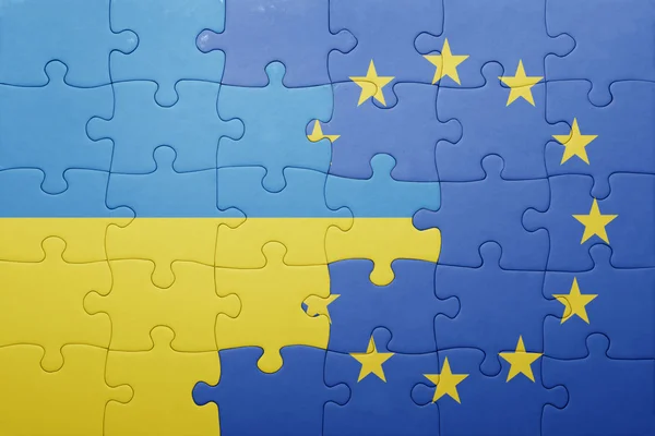 Puzzle with the national flag of ukraine and european union — Stock Photo, Image