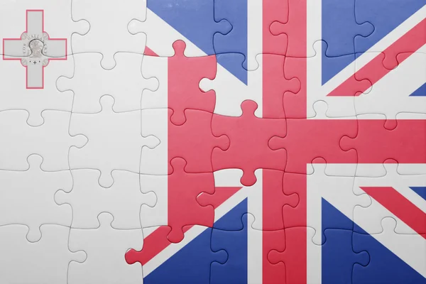 Puzzle avec le drapeau national de la Grande Bretagne et malta — Photo