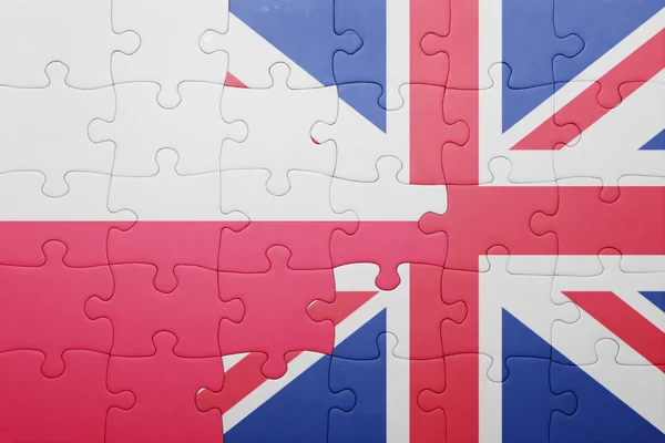 Puzzle with the national flag of great britain and poland — Stock Photo, Image