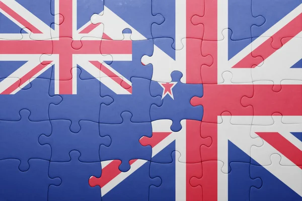 Rompecabezas con la bandera nacional de Gran Bretaña y Nueva Zelanda — Foto de Stock