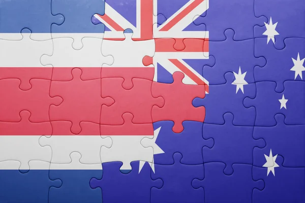 Puzzle avec le drapeau national de la Costa Rica et de l'Australie — Photo