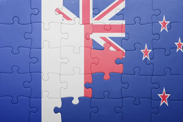 Puzzle avec le drapeau national de la France et de la Nouvelle-Zélande — Photo