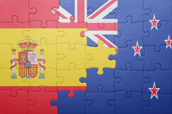 スペイン、ニュージーランドの国旗をパズルします。 — ストック写真