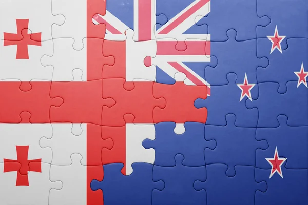 Puzzle avec le drapeau national de la géorgie et de la Nouvelle-Zélande — Photo