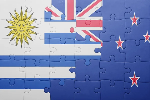 Puzzle with the national flag of uruguay and new zealand — Stock Photo, Image