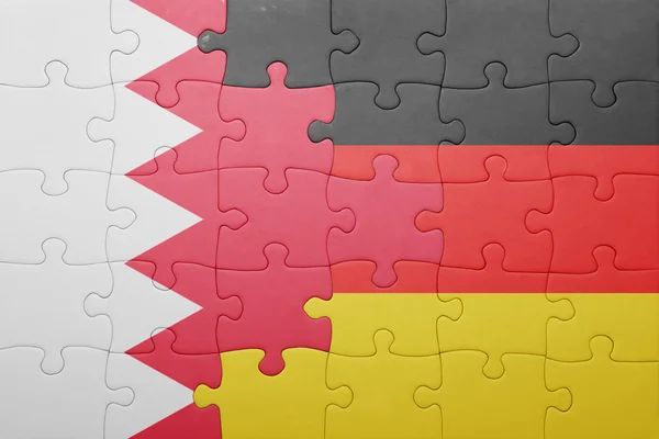 Puzzle mit der Nationalflagge Deutschlands und Bahrains — Stockfoto