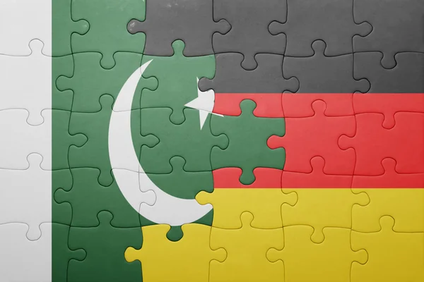 Puzzle with the national flag of germany and pakistan — Stock Photo, Image