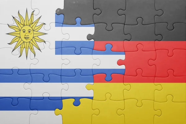 Puzzle with the national flag of germany and uruguay — Stock Photo, Image