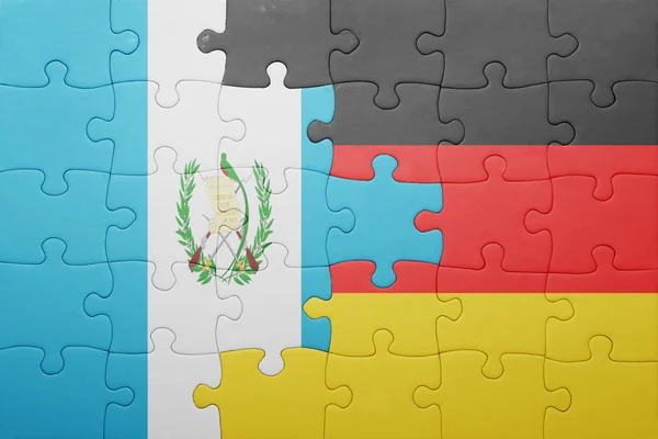 Rompecabezas con la bandera nacional de Alemania y Guatemala — Foto de Stock