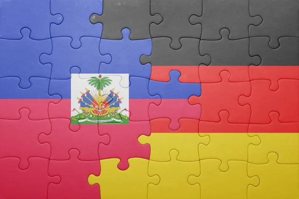 Puzzle with the national flag of germany and haiti — Stock Photo, Image