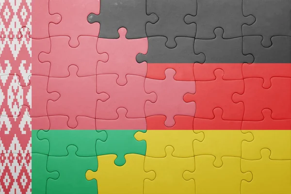 Puzzle mit der Nationalflagge von Weißrussland und Deutschland — Stockfoto