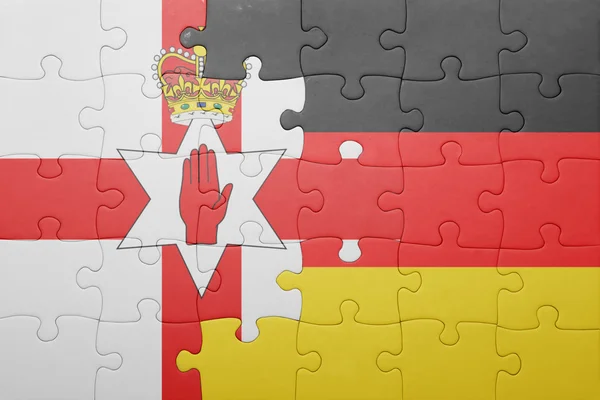 Puzzle with the national flag of northern ireland and germany — Stock Photo, Image