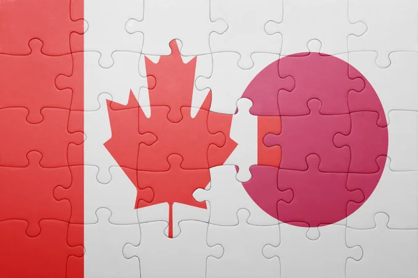Puzzle con la bandiera nazionale del Canada e del Giappone — Foto Stock