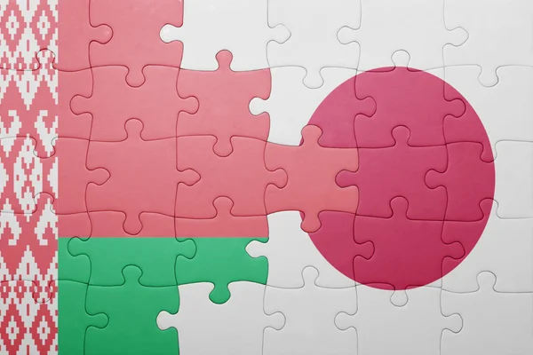 Puzzle con la bandiera nazionale di Bielorussia e Giappone — Foto Stock