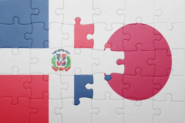 Rompecabezas con la bandera nacional de la República Dominicana y Japón — Foto de Stock