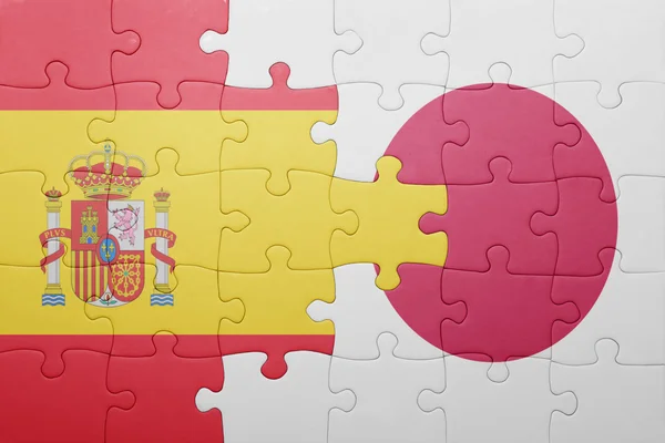 Puzzle with the national flag of spain and japan — Stock Photo, Image