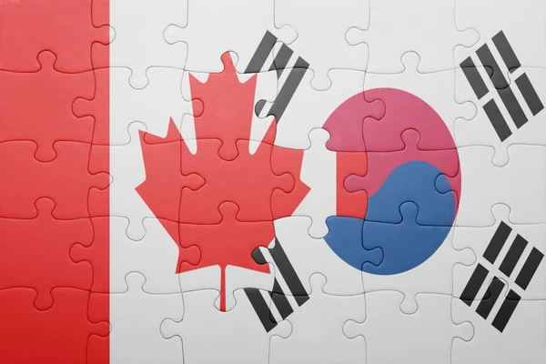 Puzzle z flagi narodowej Kanady i korea Południowa — Zdjęcie stockowe