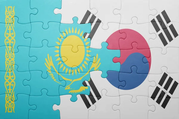 Puzzle con la bandiera nazionale del Kazakistan e Corea del Sud — Foto Stock