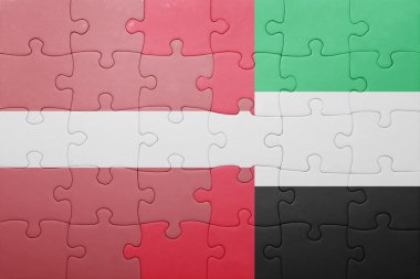 puzzle with the national flag of united arab emirates and latvia