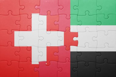 puzzle with the national flag of united arab emirates and switzerland