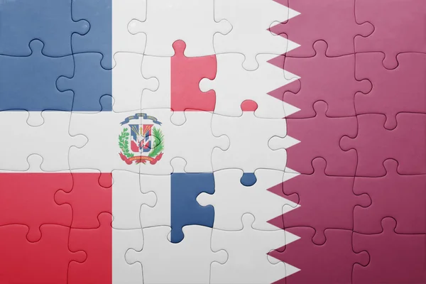 Puzzle avec le drapeau national de la République dominicaine et qatar — Photo