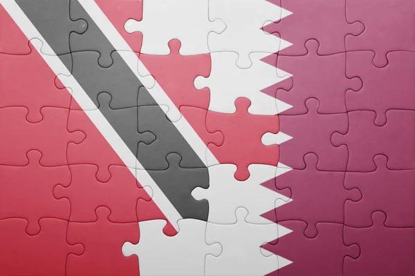 Quebra-cabeça com a bandeira nacional de trinidad e tobago e qatar — Fotografia de Stock